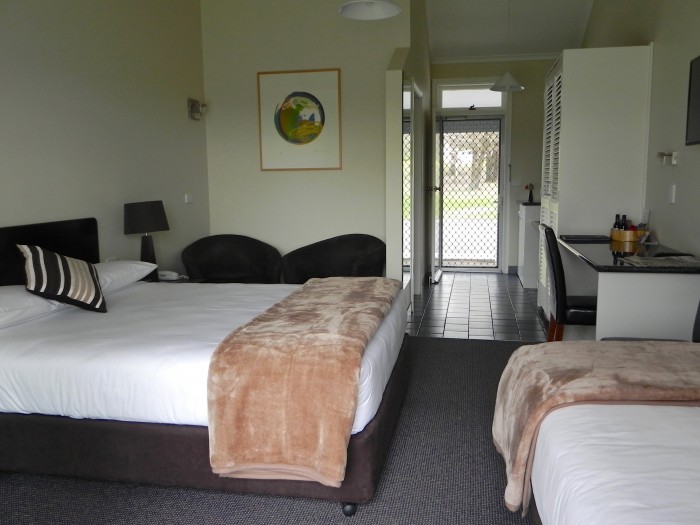 Large room at Moore Park Inn, with queen bed and single bed. Ensuite and kitchenette and eating area.